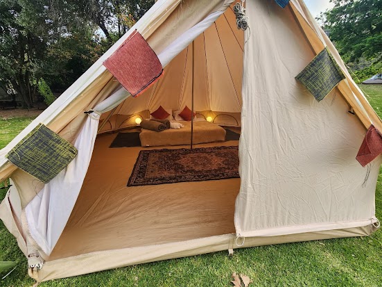 luxurious bell tent interior at Waterfall Farm